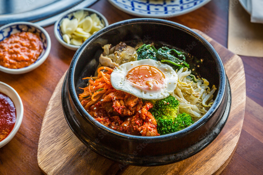 picture of bibimbap with fried egg on top